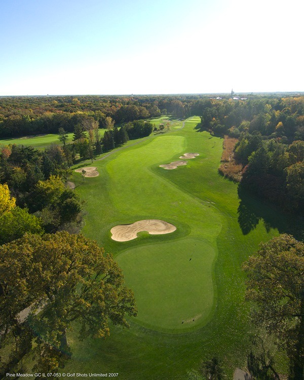 Aerial view of Hole 16's tree-lined green and fairway